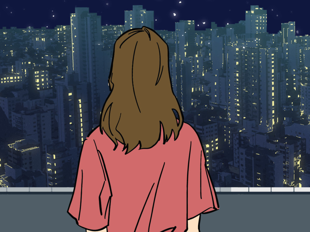 Person looking out on cityscape.